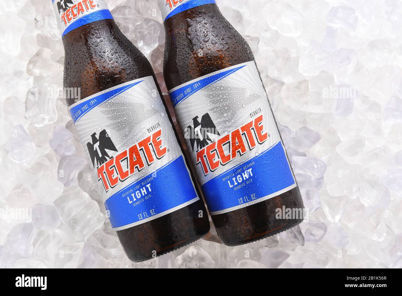 IRVINE, CA - JUNE 14, 2017: Tecate Light bottles on Ice.  Two bottles of Tecate Light, a popular pale lager named after the city of Tecate, Baja Calif Stock Photo