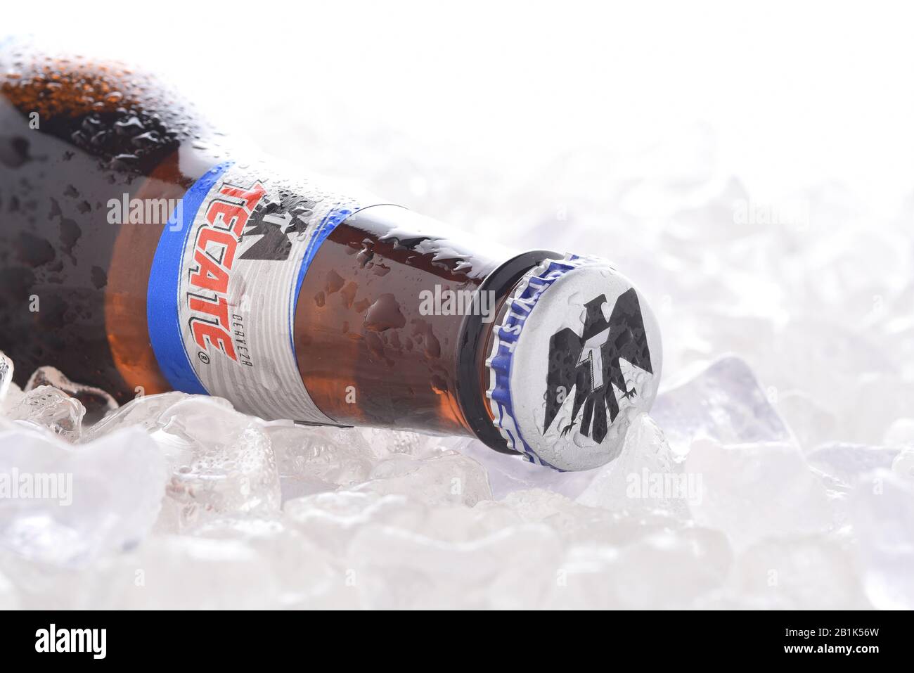 IRVINE, CA - JUNE 14, 2017: Tecate Light bottle on Ice.  A bottle of Tecate Light, a popular pale lager named after the city of Tecate, Baja Californi Stock Photo