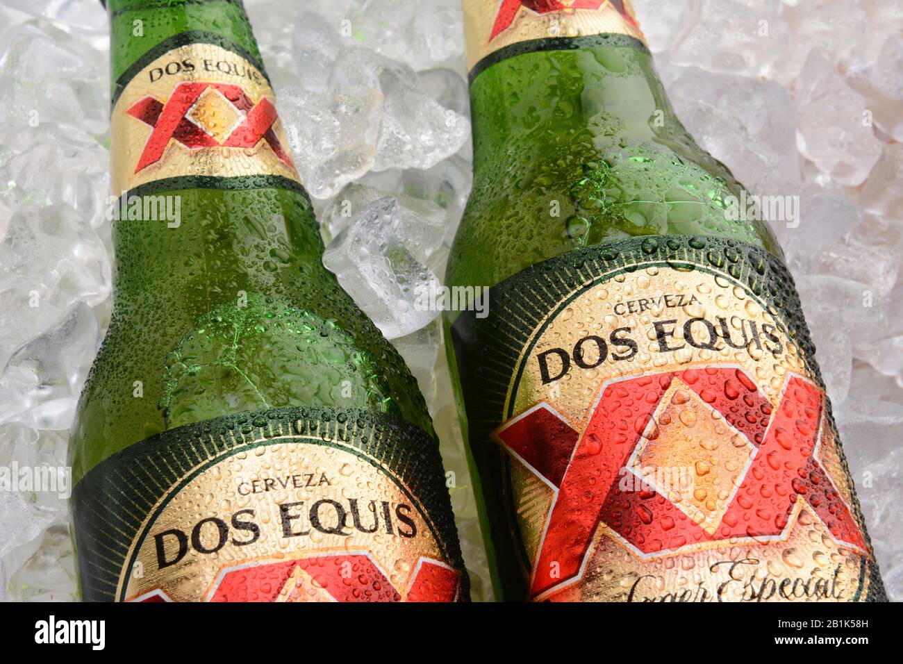 IRVINE, CA - MAY 25, 2014: Two Bottles of Dos Equis Lager Especial on a bed of ice. Founded in 1890 from the Cuauhtemoc-Moctezuma Brewery in Monterrey Stock Photo