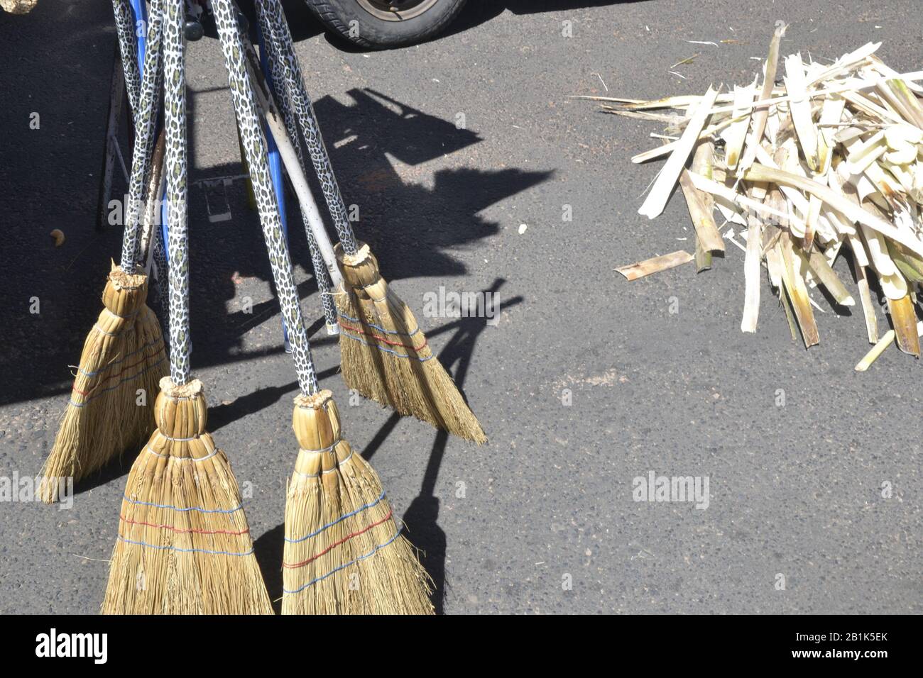 Straw broom also known as piassava on sale at a street fair in Brazil, South America, cheap and widely used broom Stock Photo