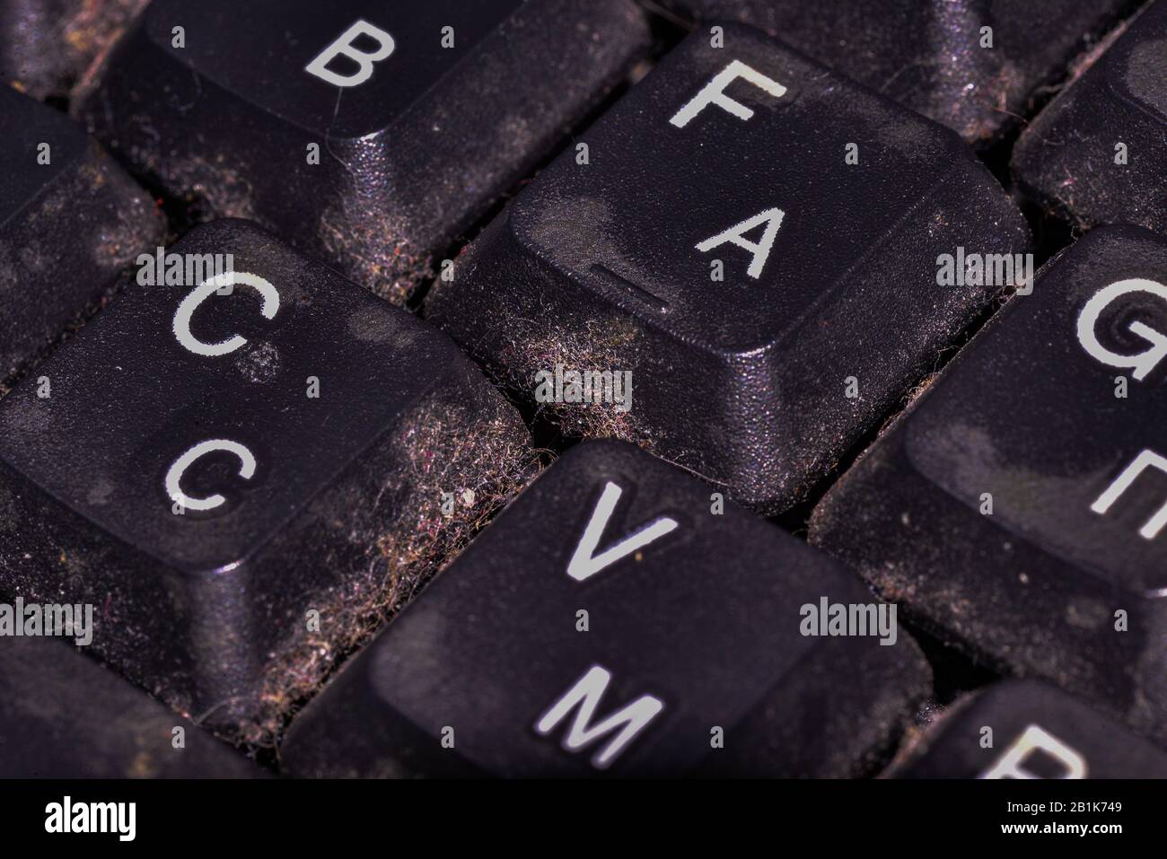 Soiled computer keyboard, sloppy user, dirt and IT Stock Photo