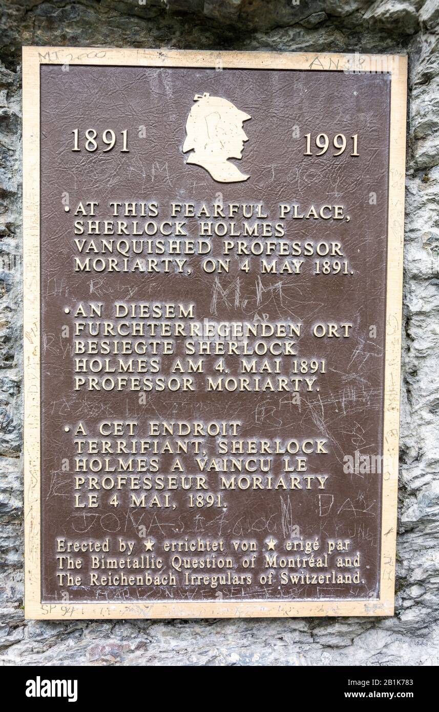 Meiringer, Switzerland – June 26, 2016. The Sherlock Holmes plaque on the ledge by the Reichenbach Falls waterfall in Switzerland. The waterfall was t Stock Photo