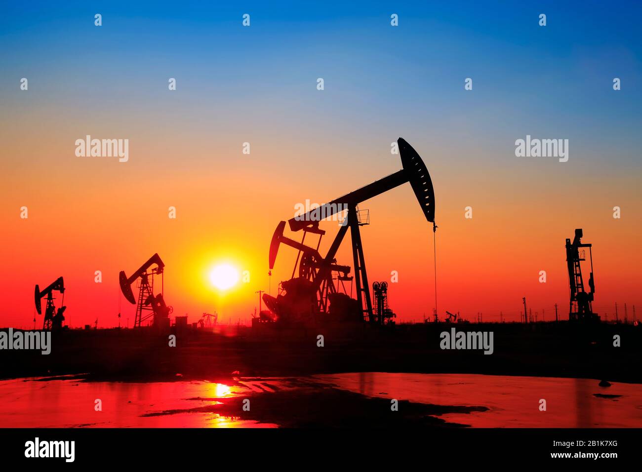 In the evening, the silhouette of the oil pump Stock Photo