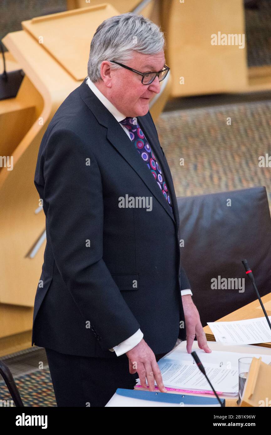 Edinburgh, UK. 26th Feb, 2020. Pictured: Fergus Ewing MSP - Cabinet Secretary for the Rural Economy. Ministerial Statement: Modernising and Empowering Scotland's Inshore Fisheries. Scenes from inside the debating chamber of the Scottish Parliament. Credit: Colin Fisher/Alamy Live News Stock Photo