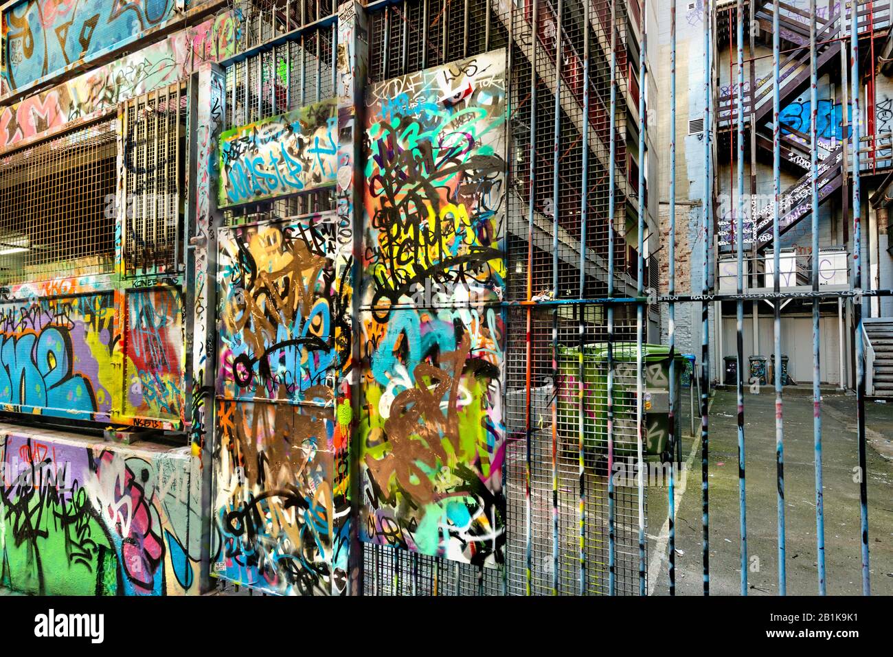 Graffiti scrawled tags covering reinforced gate in laneway, Hosier Street, Melbourne Lanes, Melbourne, Victoria, Australia Stock Photo