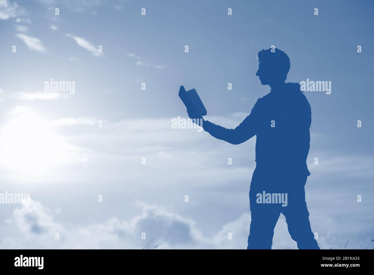 Silhouette of a men against beautiful romantic sunset sky with clouds ...
