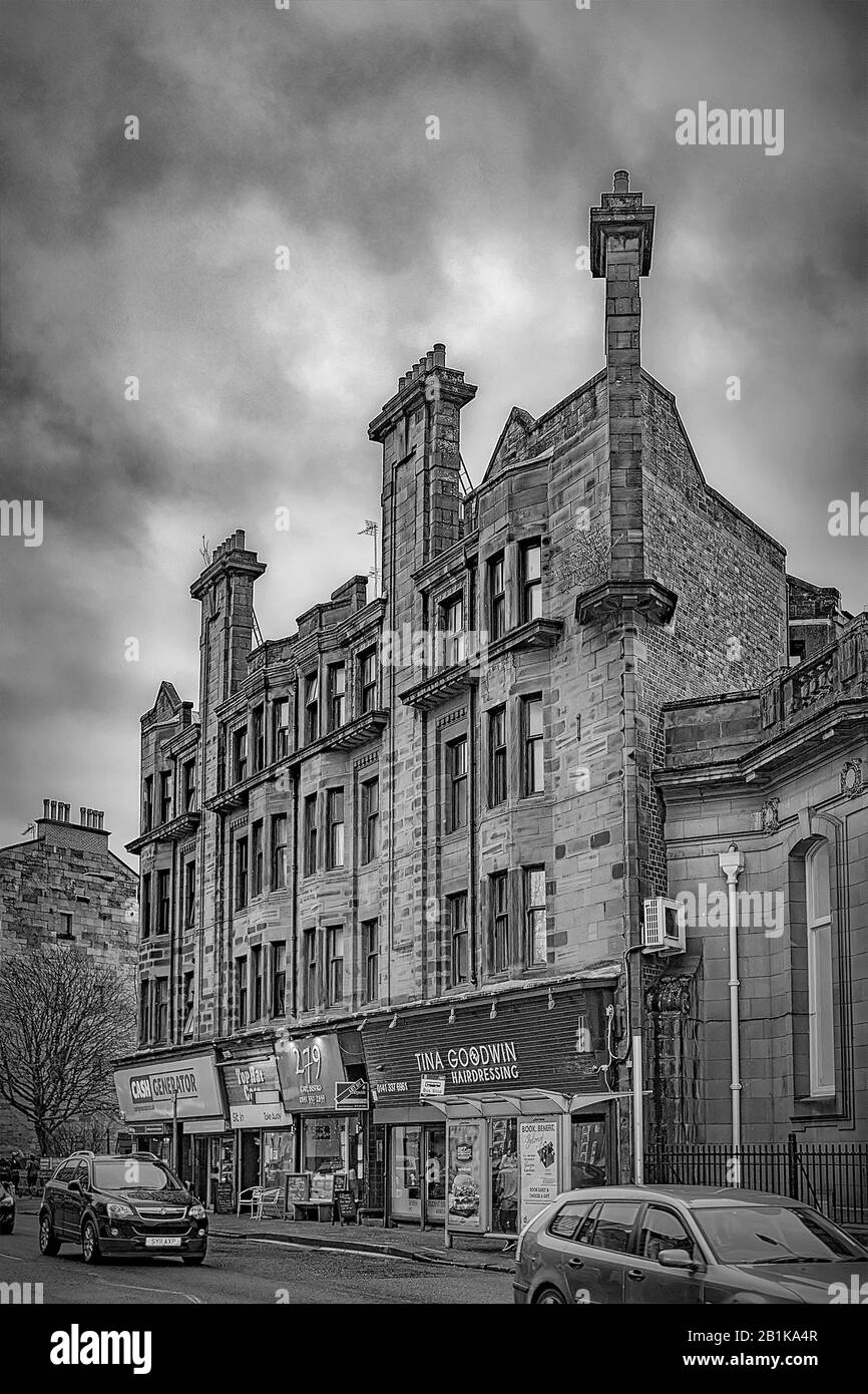 GLASGOW, SCOTLAND - JANUARY 25, 2020: A typical red sandstone tenement block in the Partick area to the west of the city with a black and white edit. Stock Photo