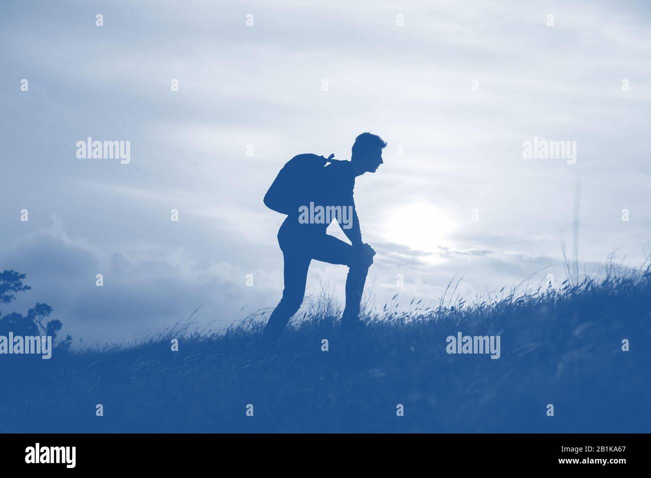 Silhouette of a men against beautiful romantic sunset sky with clouds ...