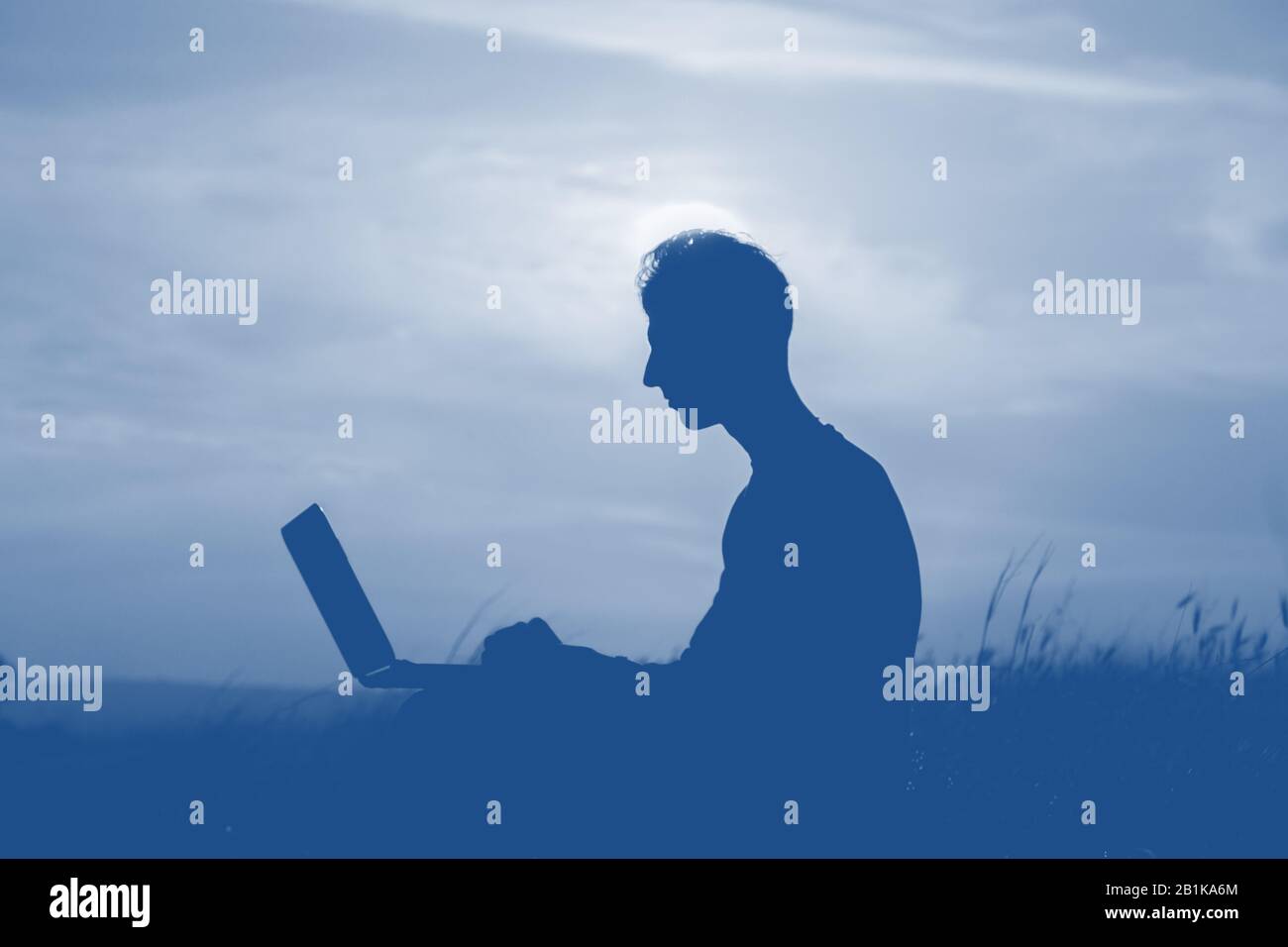 Silhouette of a men against beautiful romantic sunset sky with clouds ...