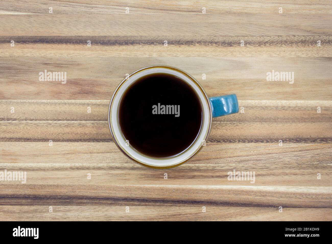 Top View of a Simple Shot of a Black Coffee on a Rustic Wooden Table Stock Photo