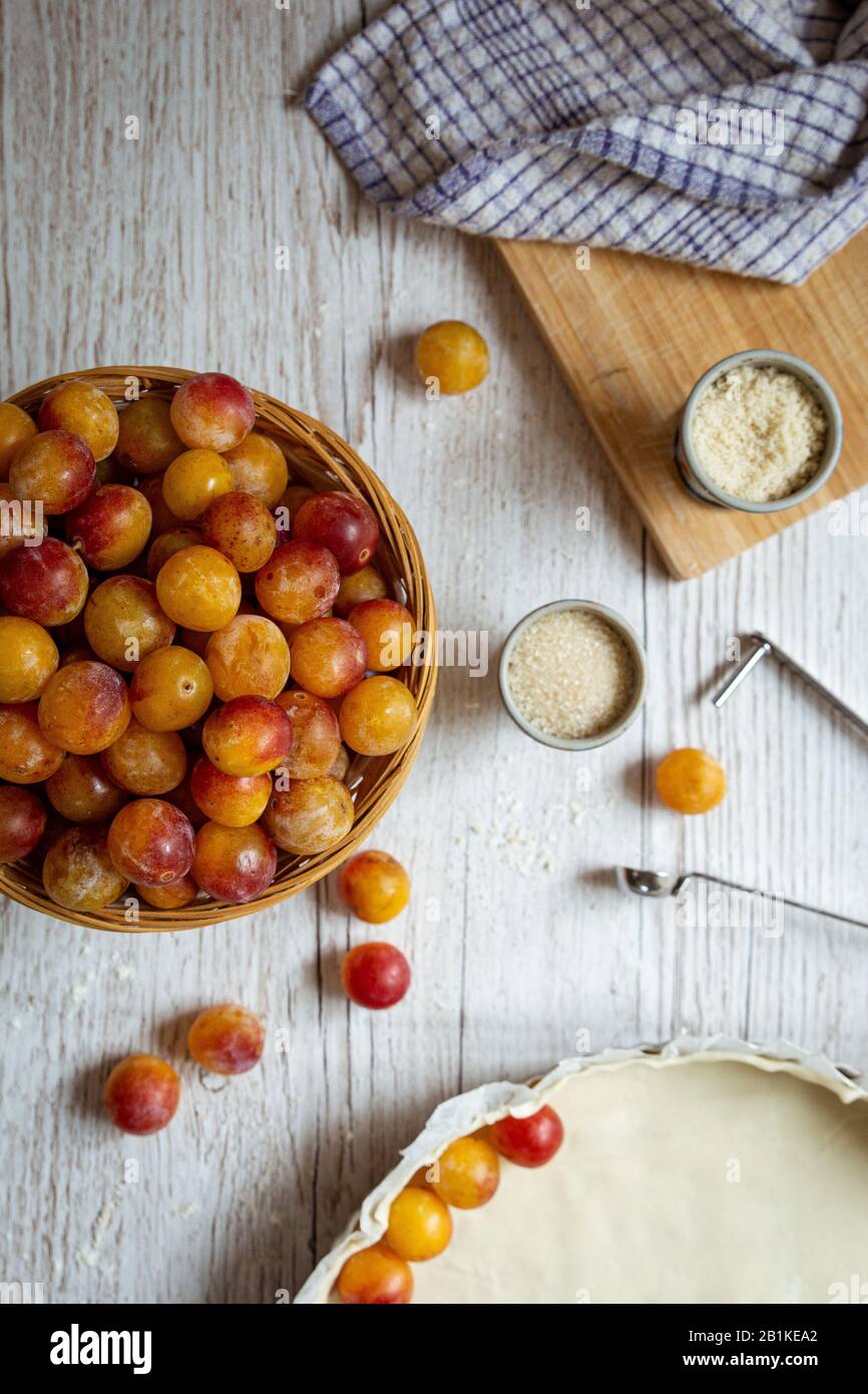 preparation of a mirabelle plum pie Stock Photo Alamy