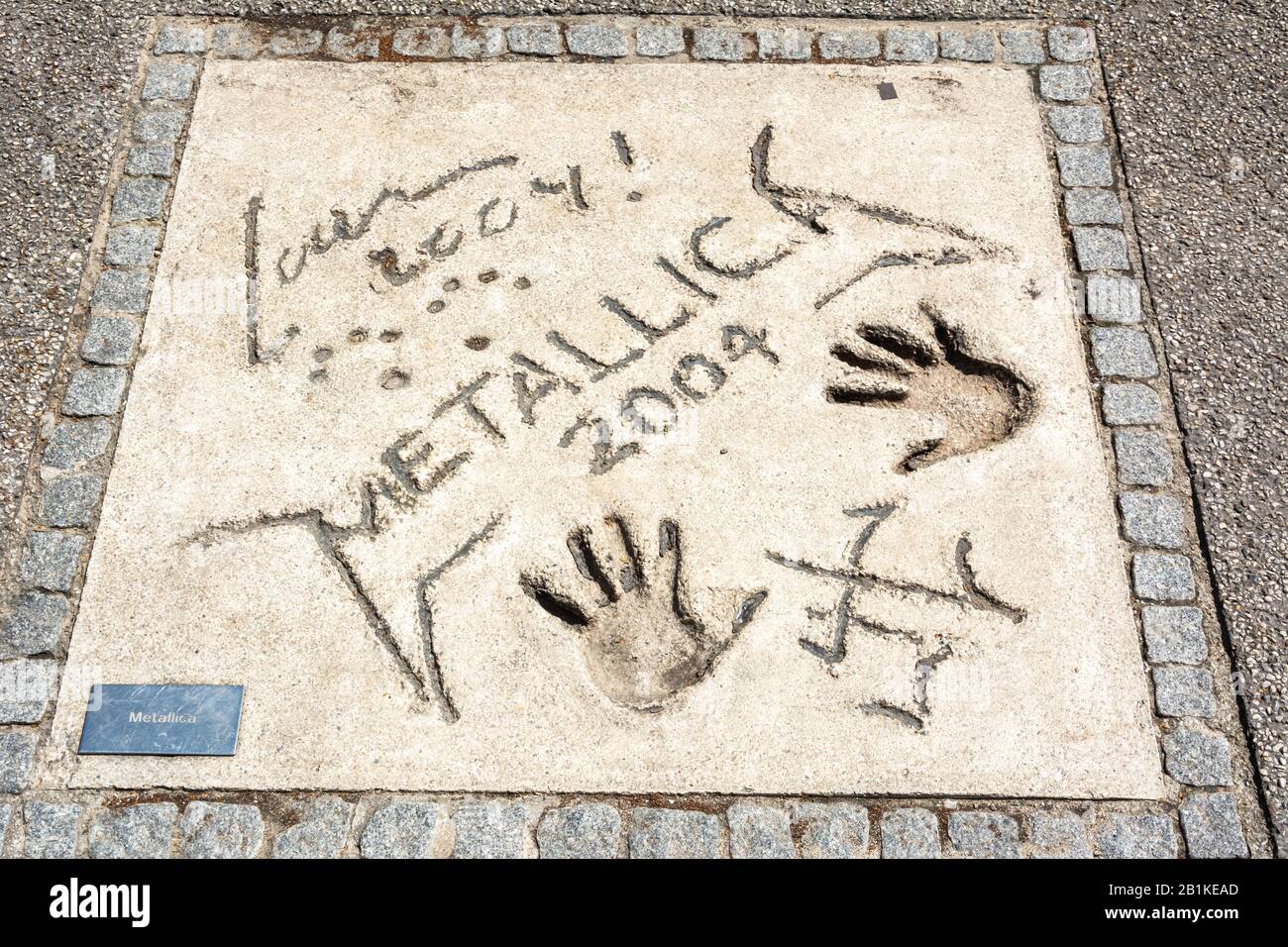 Munich, Germany – July 1, 2016. Mark of American heavy metal band Metallica with hands and signets in the concrete at the Olympic Walk of Stars in Mun Stock Photo