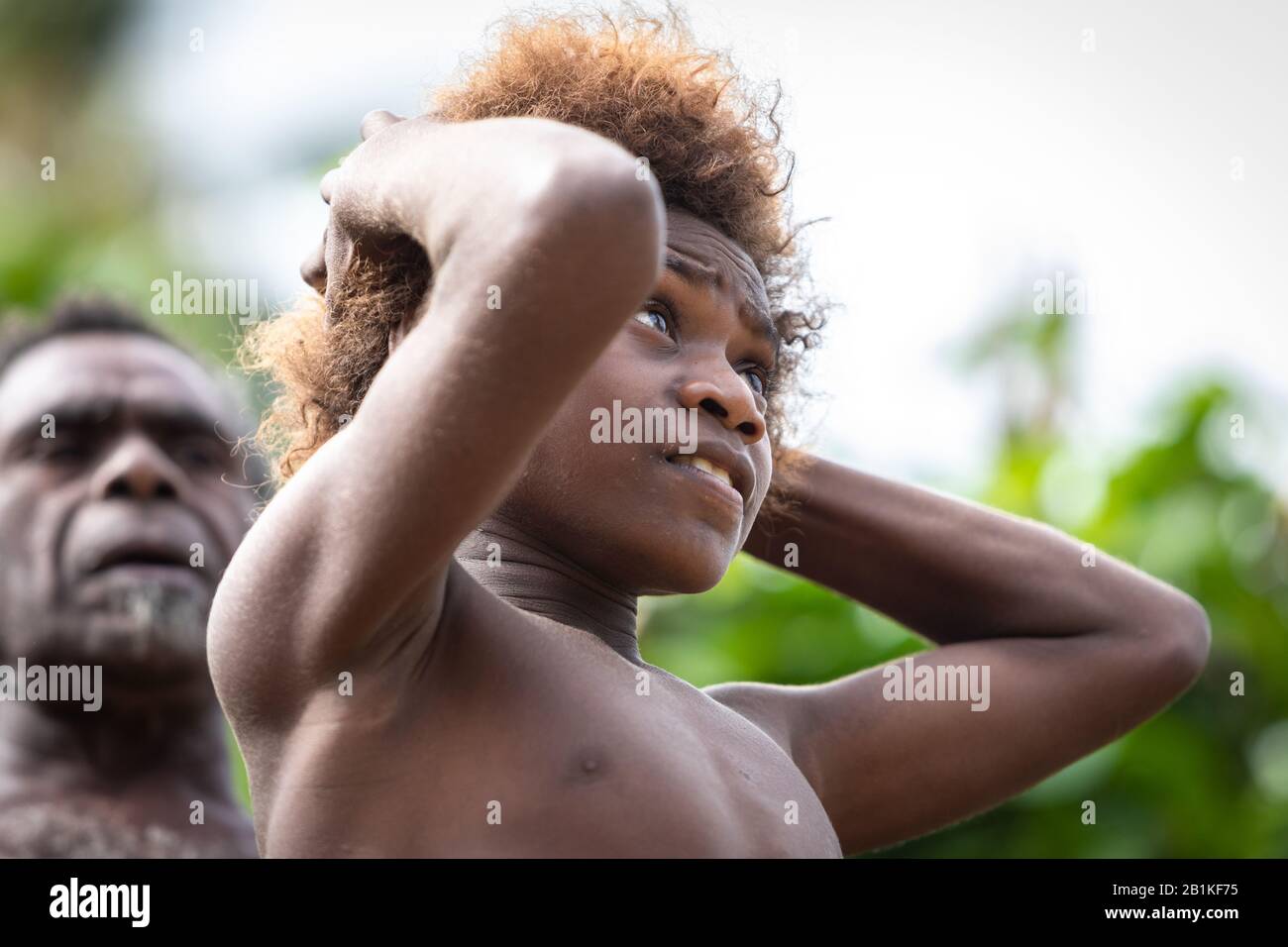 Pentecost island Vanuatu, South Pacific, Oceania : Melanesian boy portrait looking up smiling Stock Photo