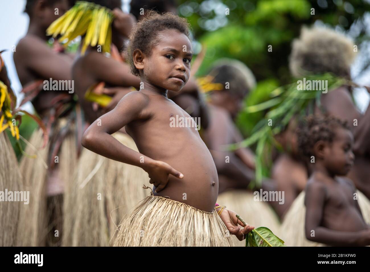 Vanuatu, South Pacific, Oceania -  Melanesian girl in traditional grass skirt portrait Stock Photo
