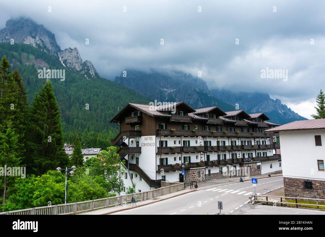 San Martino di Castrozza, Trentino, Italy – July 3, 2016. Street view in San Martino di Castrozza mountain resort in Italy, with Hotel Colfosco and th Stock Photo