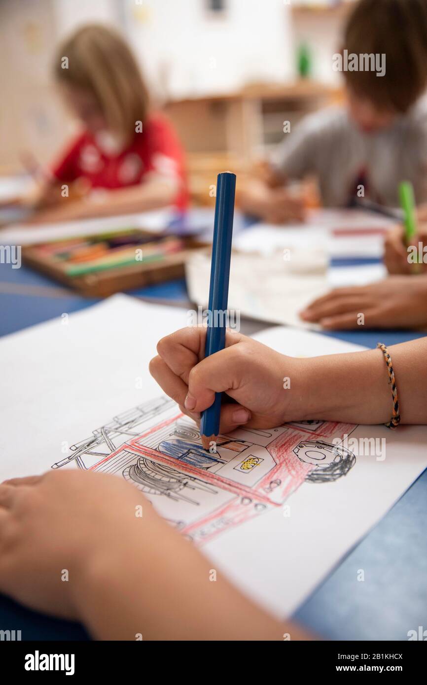 Children painting in kindergarten with crayons, Cologne, North Rhine ...