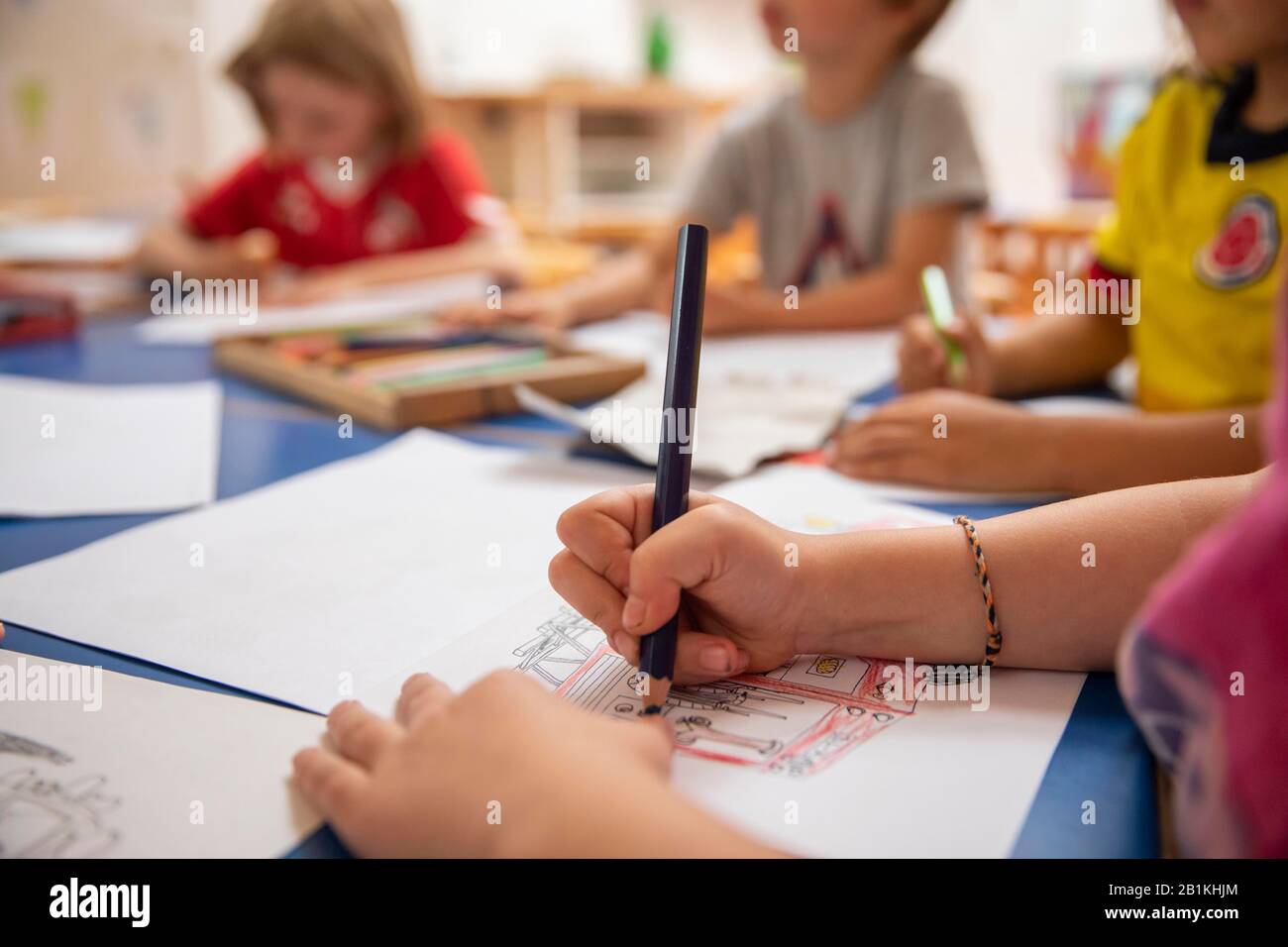 Children painting in kindergarten with crayons, Cologne, North Rhine ...
