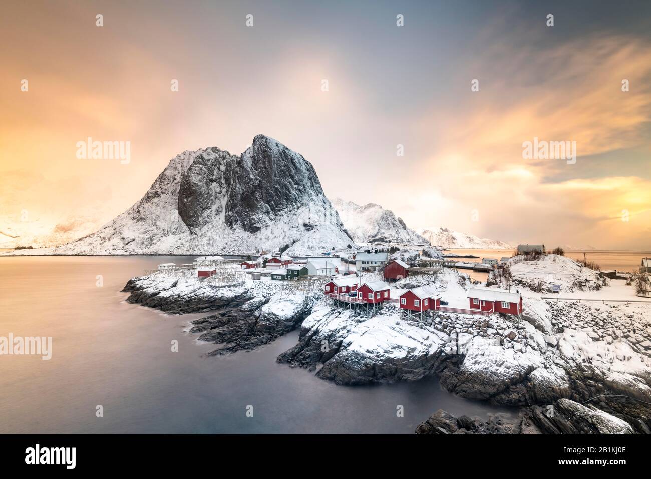 Rorbuer fishermen's cabins by the snowy fjord, Hamnoya, Moskenesoy, Lofoten, Norway Stock Photo