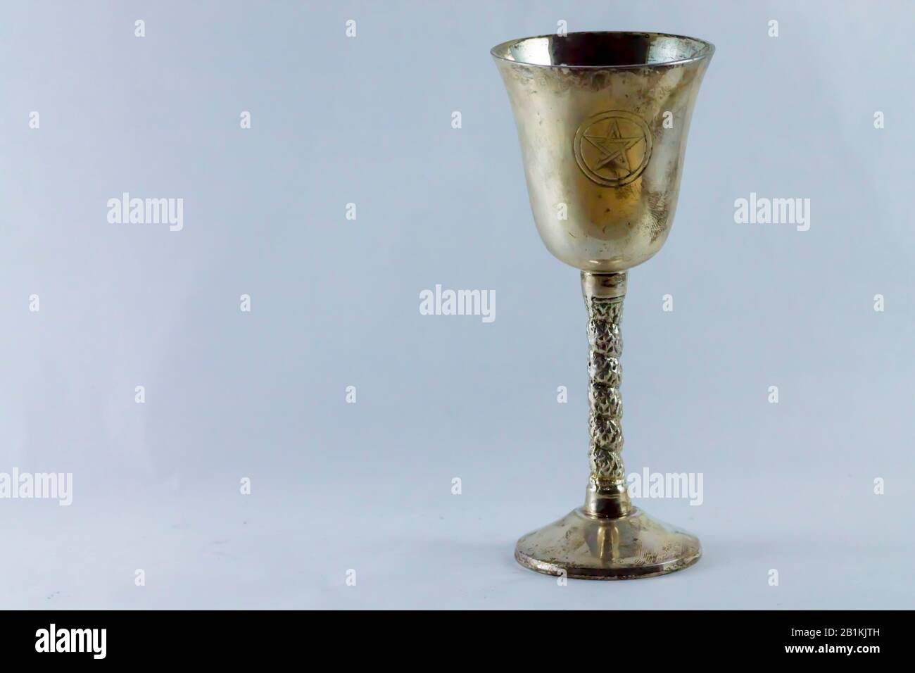 brass chalice with engraved pentacle Stock Photo