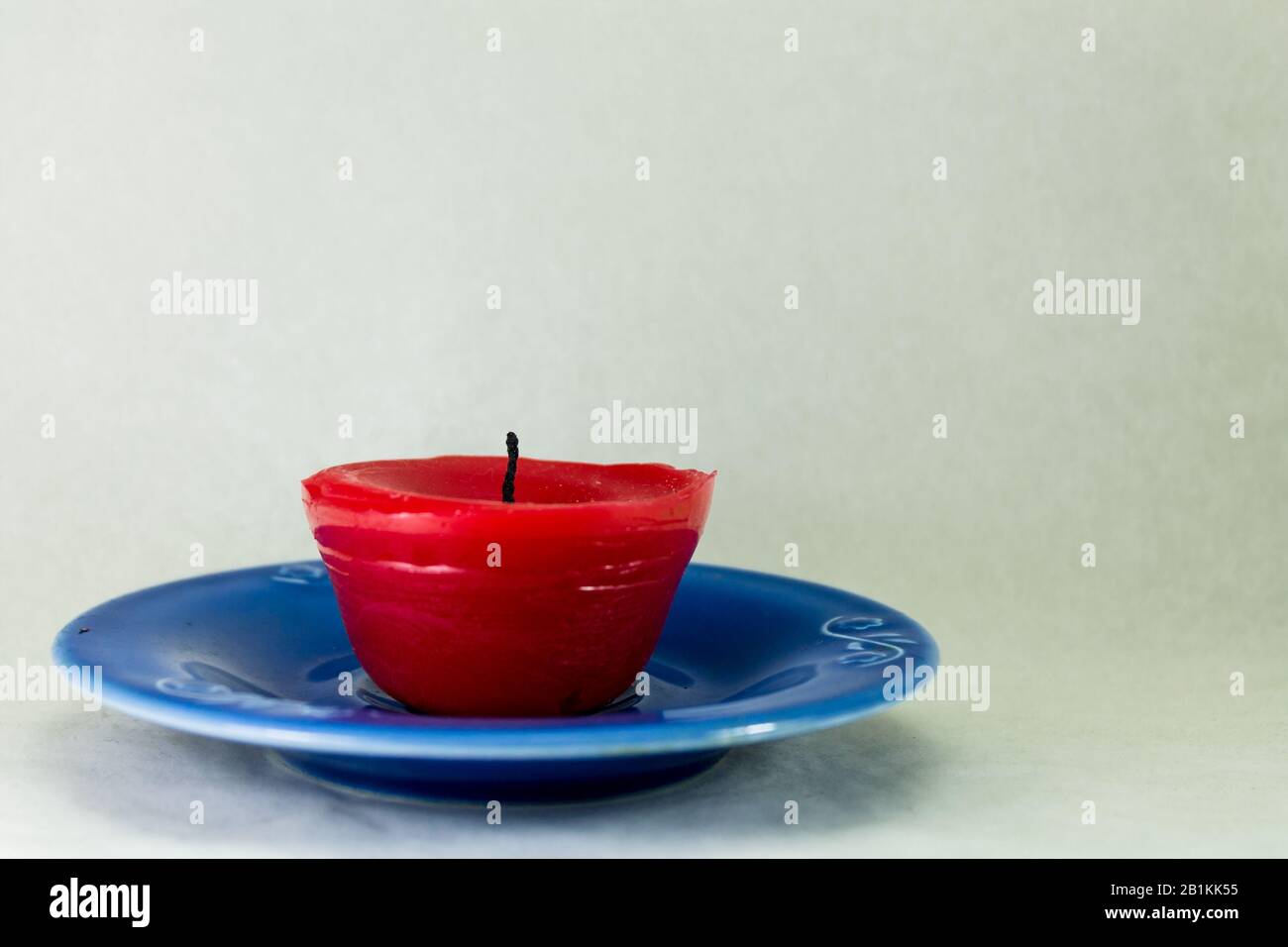 wax candle on a saucer Stock Photo Alamy