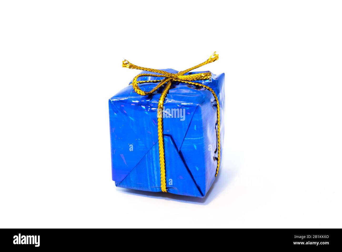 Gift box with golden ribbon isolated on white Stock Photo - Alamy