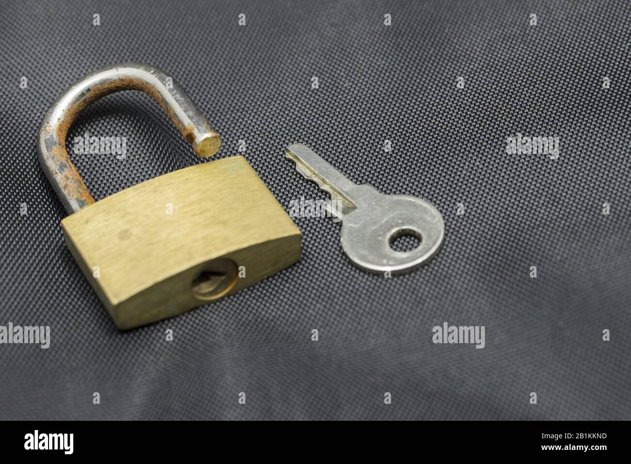 open padlock with key Stock Photo Alamy