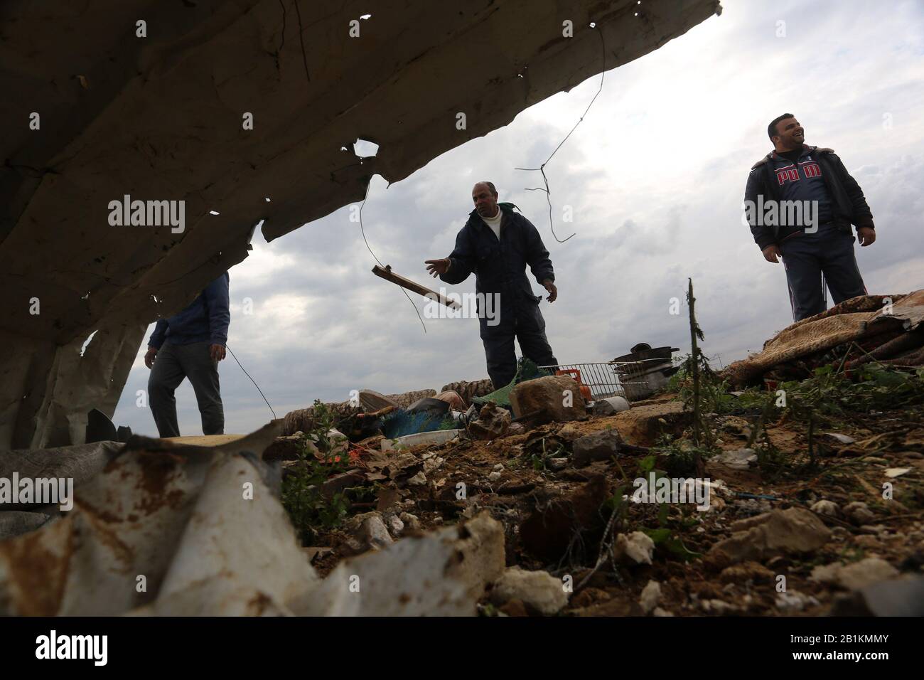 Palestinians inspect the site after of an Israeli airstrike in Khan Yunis in the southern Gaza Strip, on February 25, 2020. Photo by Abed Rahim Khatib Stock Photo