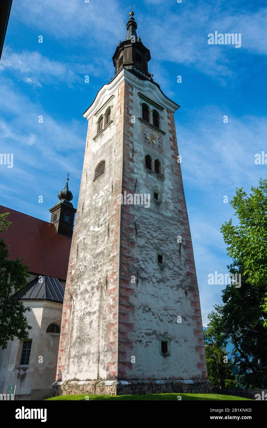 Bled, Slovenia – July 5, 2019. Tower of the pilgrimage church dedicated to the Assumption of Mary (Cerkev Marijinega vnebovzetja) on Bled Island in Sl Stock Photo