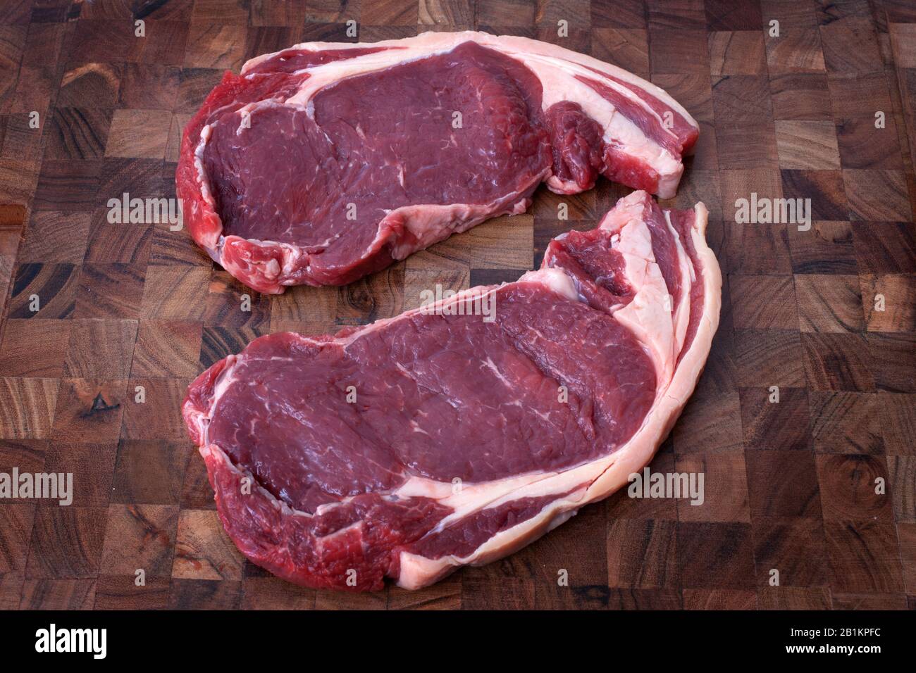 2 raw ribeye steaks Stock Photo Alamy
