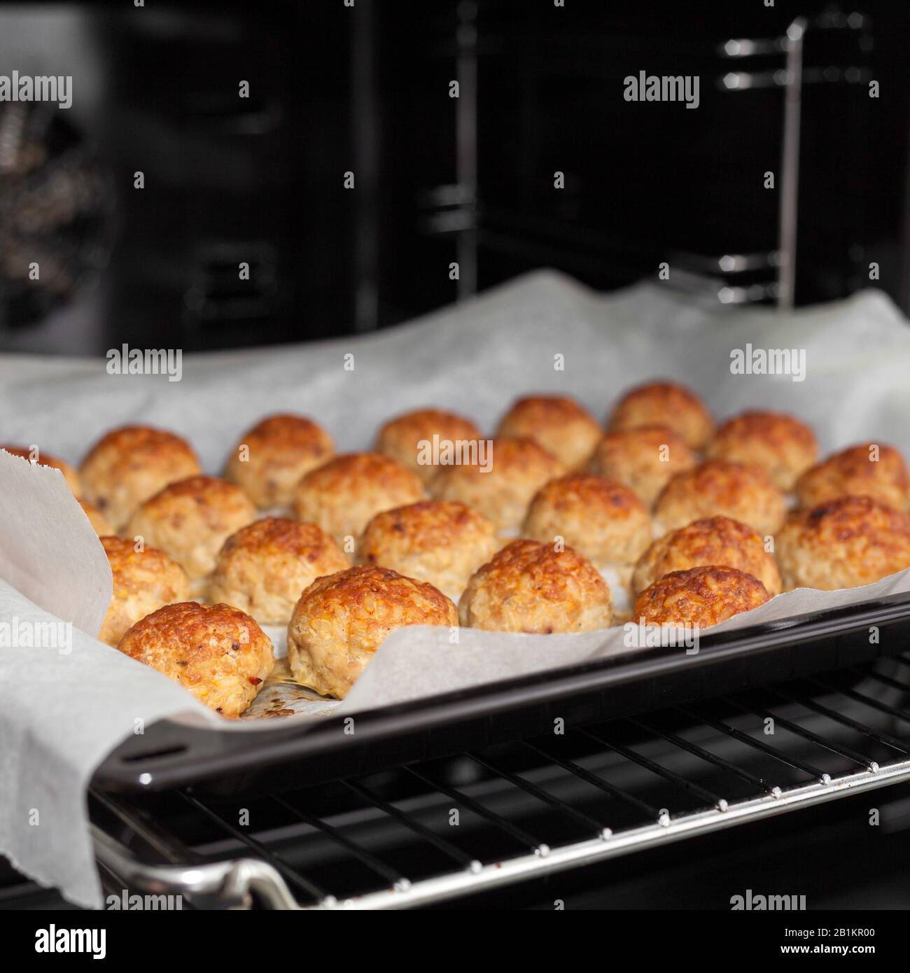 Meatballs in the oven. Homemade fried beef patties. Baked on parchment