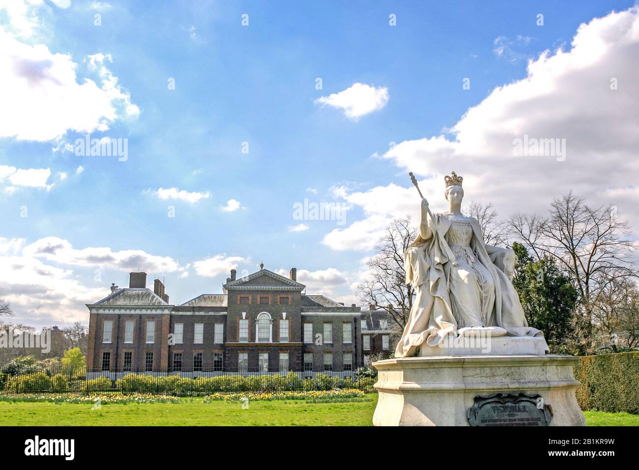 Statue of Queen Victoria stands in front of her birthplace and former residence, Kensington Palace, London, England. Stock Photo