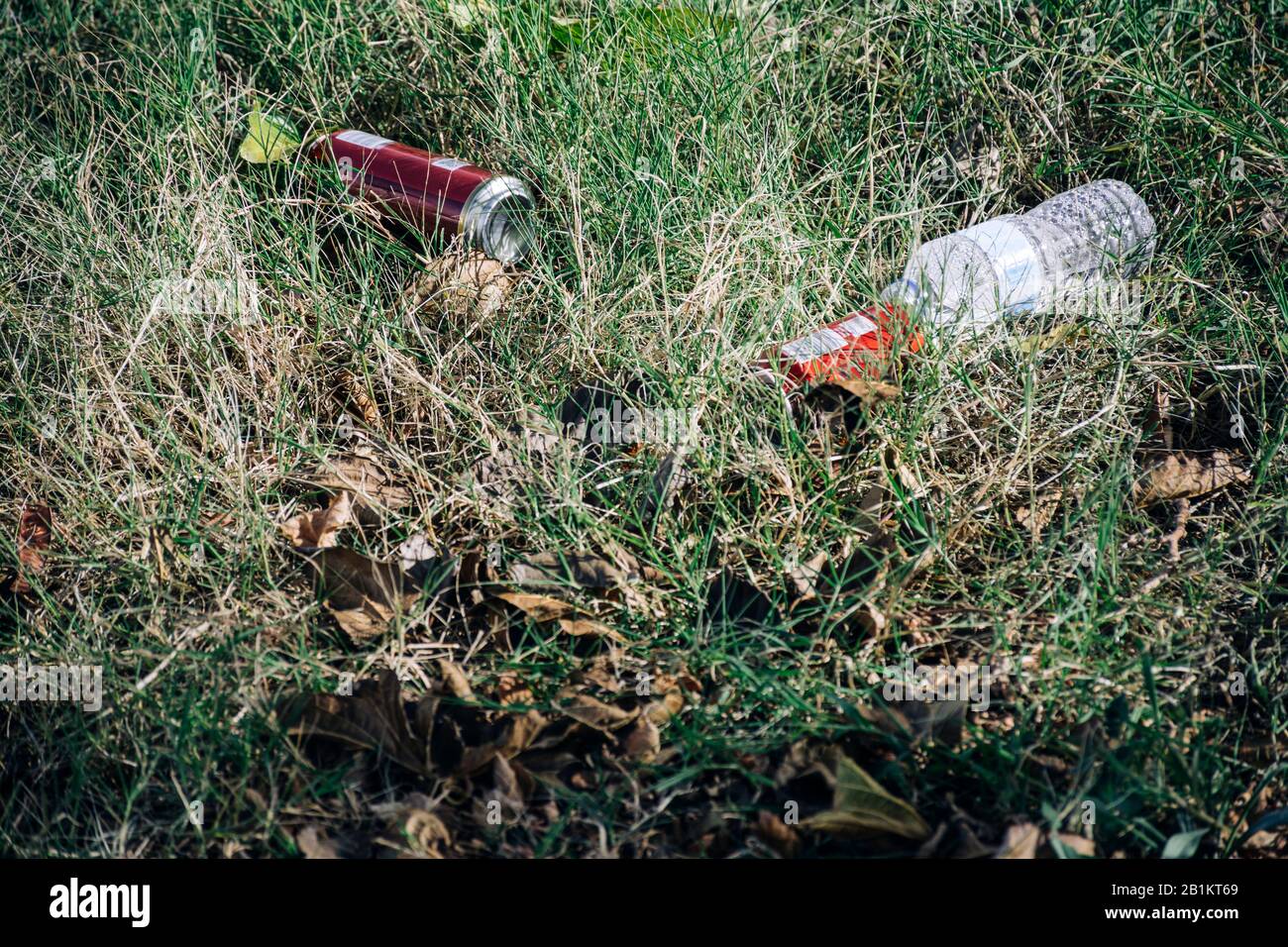 Trash lying on the ground. Plastic bottles and aluminum cans. Concept