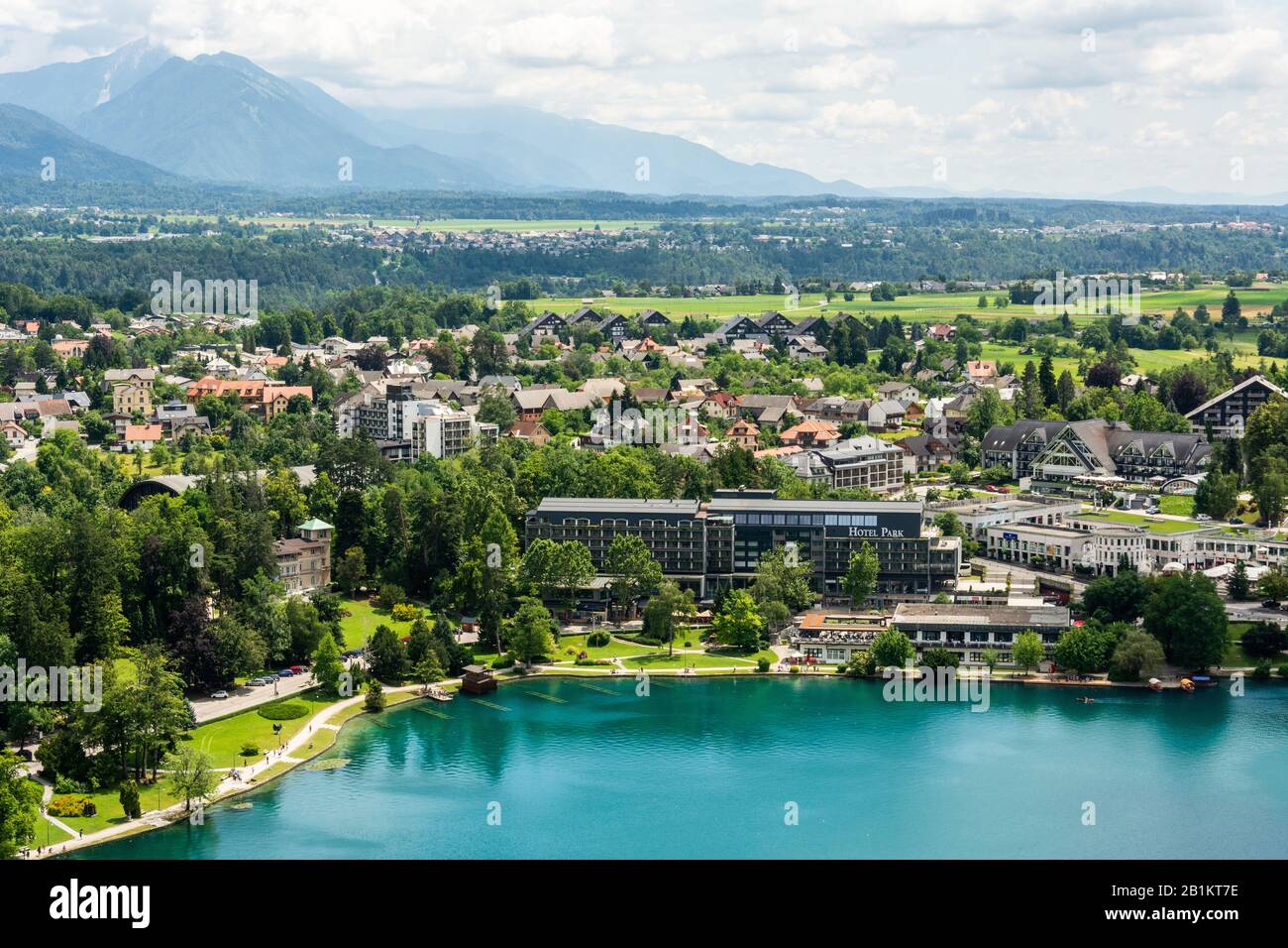 Bled, Slovenia – July 6, 2019. View over Bled town on the shore of Lake Bled in Slovenia. View with commercial properties and residential buildings in Stock Photo