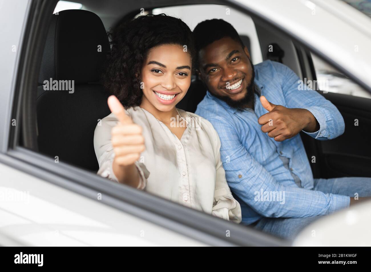 Happy woman sitting in car 20s adult hi-res stock photography and ...