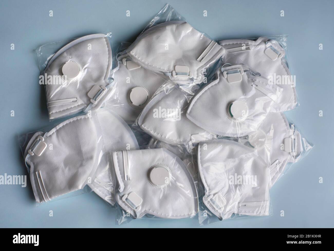 A lot of medical face dust masks, disposable FFP3 respirators. Concept of coronavirus, air pollution, virus, flu, infectious diseases and precautions. Stock Photo