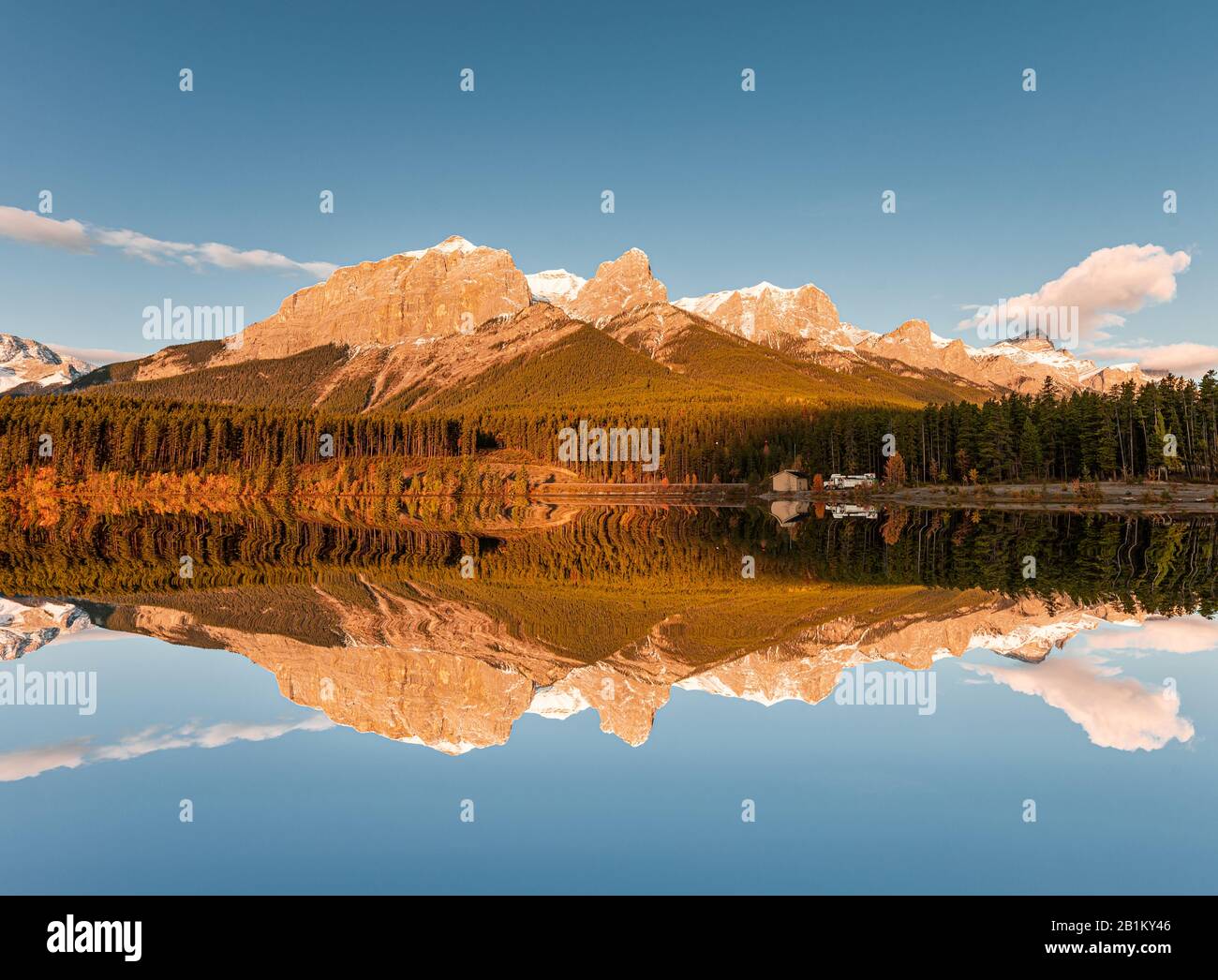Sunrise on Mount Rundle with blue sky reflection on Rundle Forebay