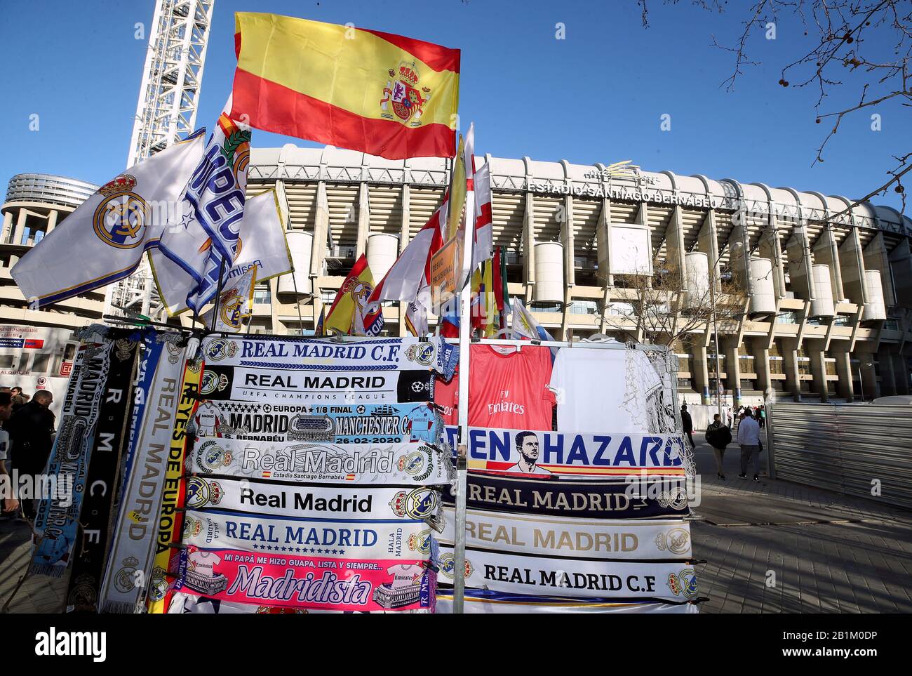 Scarves for sale outside the ground ahead of the UEFA Champions League round of 16 first leg match at the Santiago Bernabeu, Madrid. Stock Photo