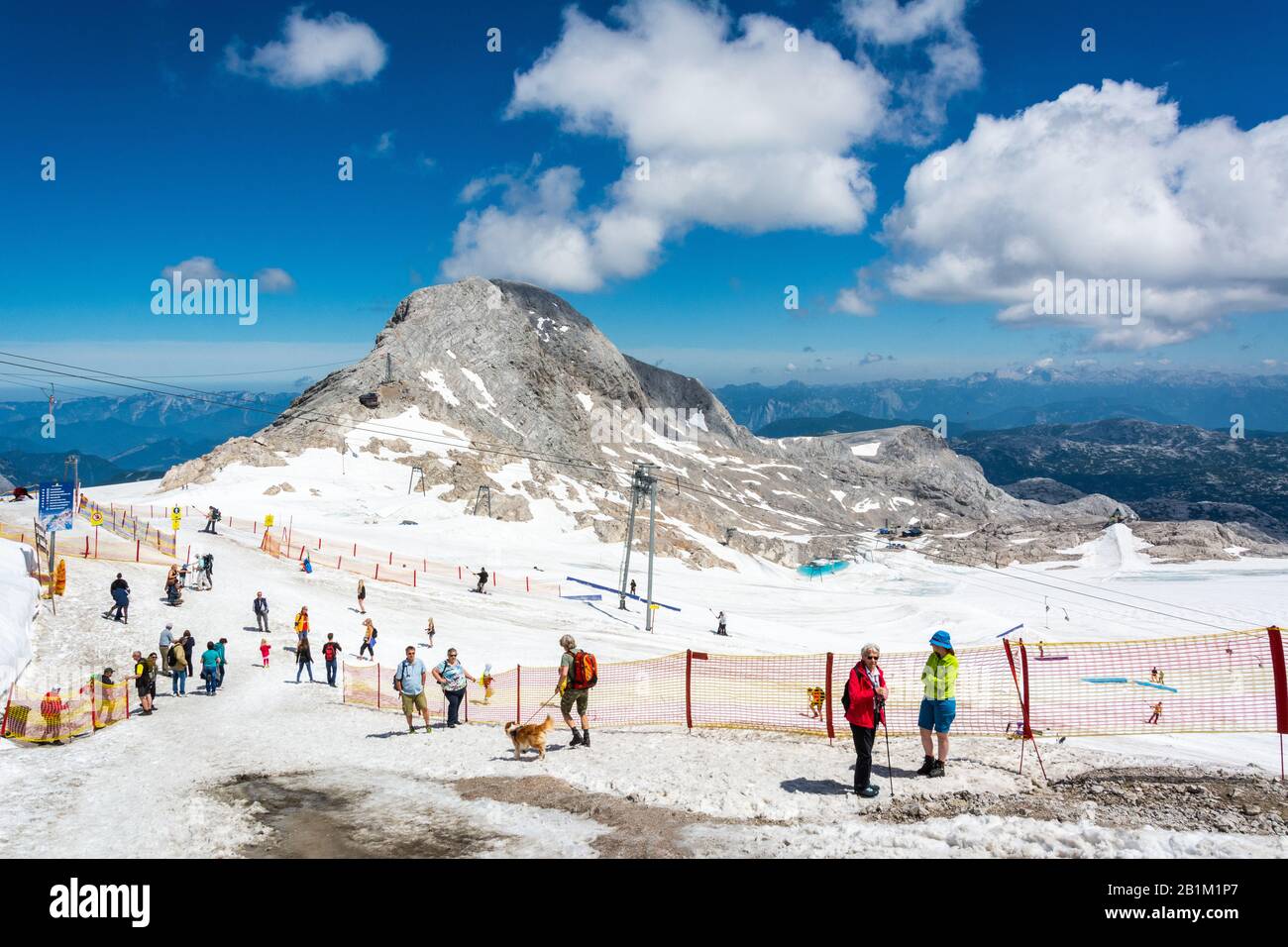 Ramsau am Dachstein, Austria – July 10, 2016. Dachstein Glacier in Austria, with people and Hoher Gjaidstein mountain (2,794m) in the background, in s Stock Photo