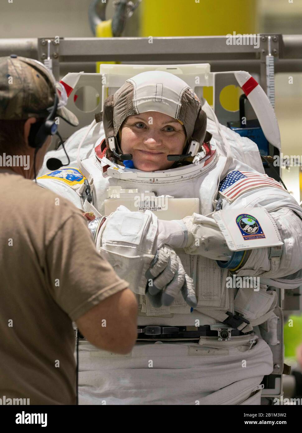 Veteran astronaut Anne C. McClain suits up in NASA's Neutral Buoyancy Lab for weightlessness training in the 6.2 million gallon pool containing a mock-up of the International Space Station (ISS) in Houston. Stock Photo