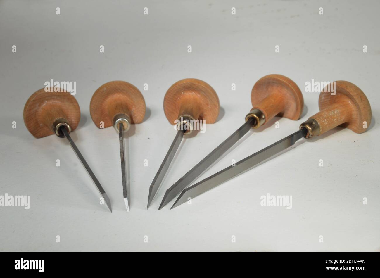 Arrangement with graving tools with cutting edges in different shapes. Stock Photo