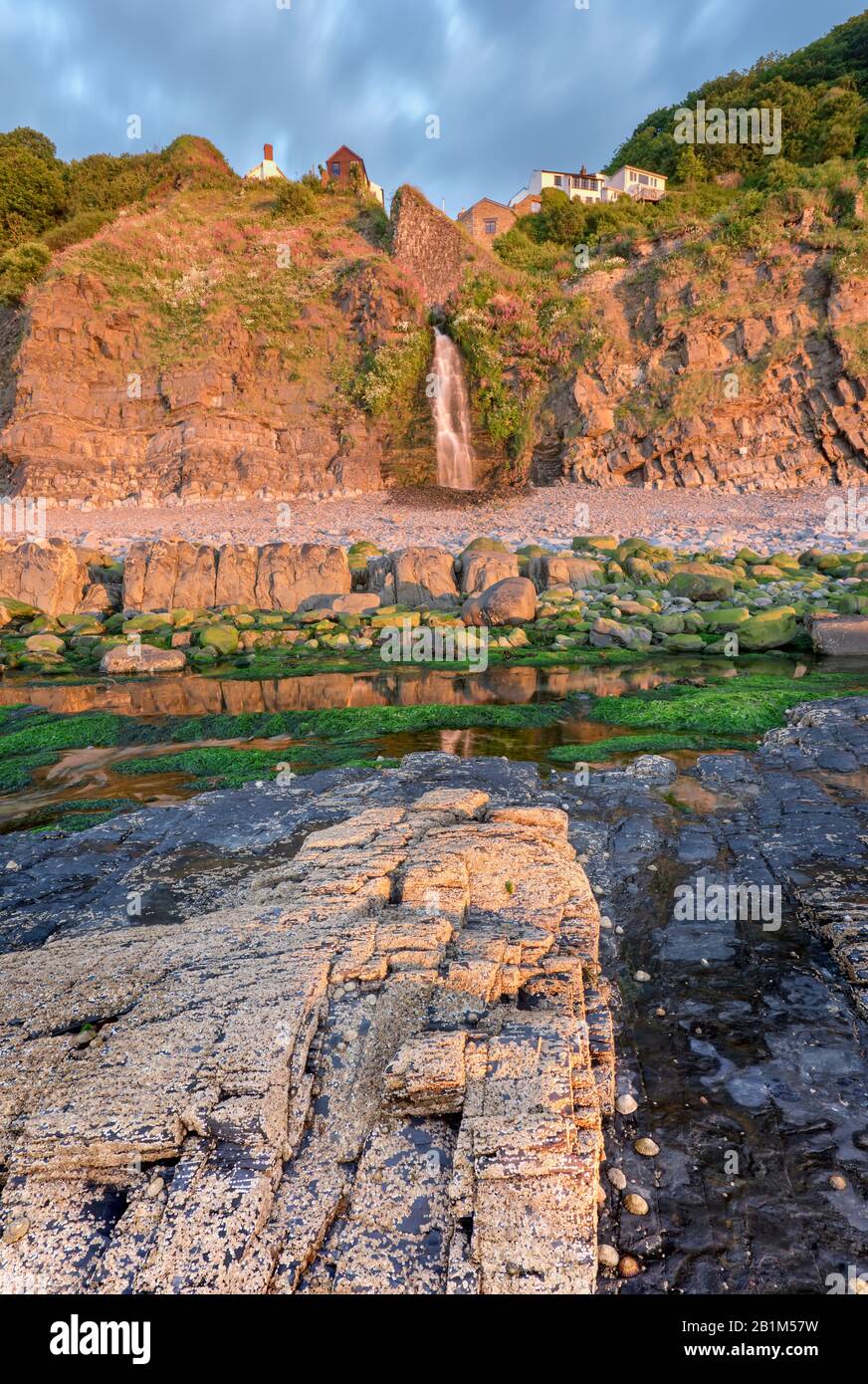 Coastal waterfall on this beach at Bucks Mills, coastal village, Geographical feature, south west coastal path, North Devon, South west Stock Photo