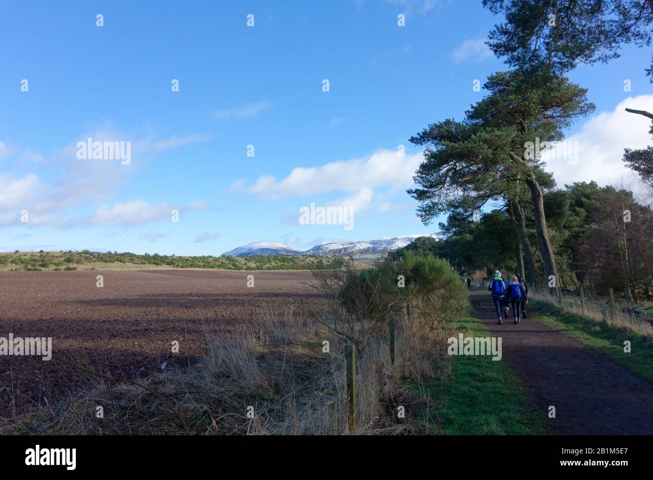 Walkers on the circular path around Loch Leven, Kinross, Scotland. Stock Photo