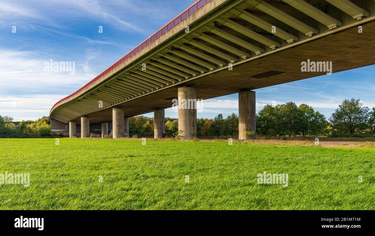 Duisburg, North Rhine-Westfalia, Germany - October 26, 2019: A meadow and the Beeckerwerther Bridge Stock Photo