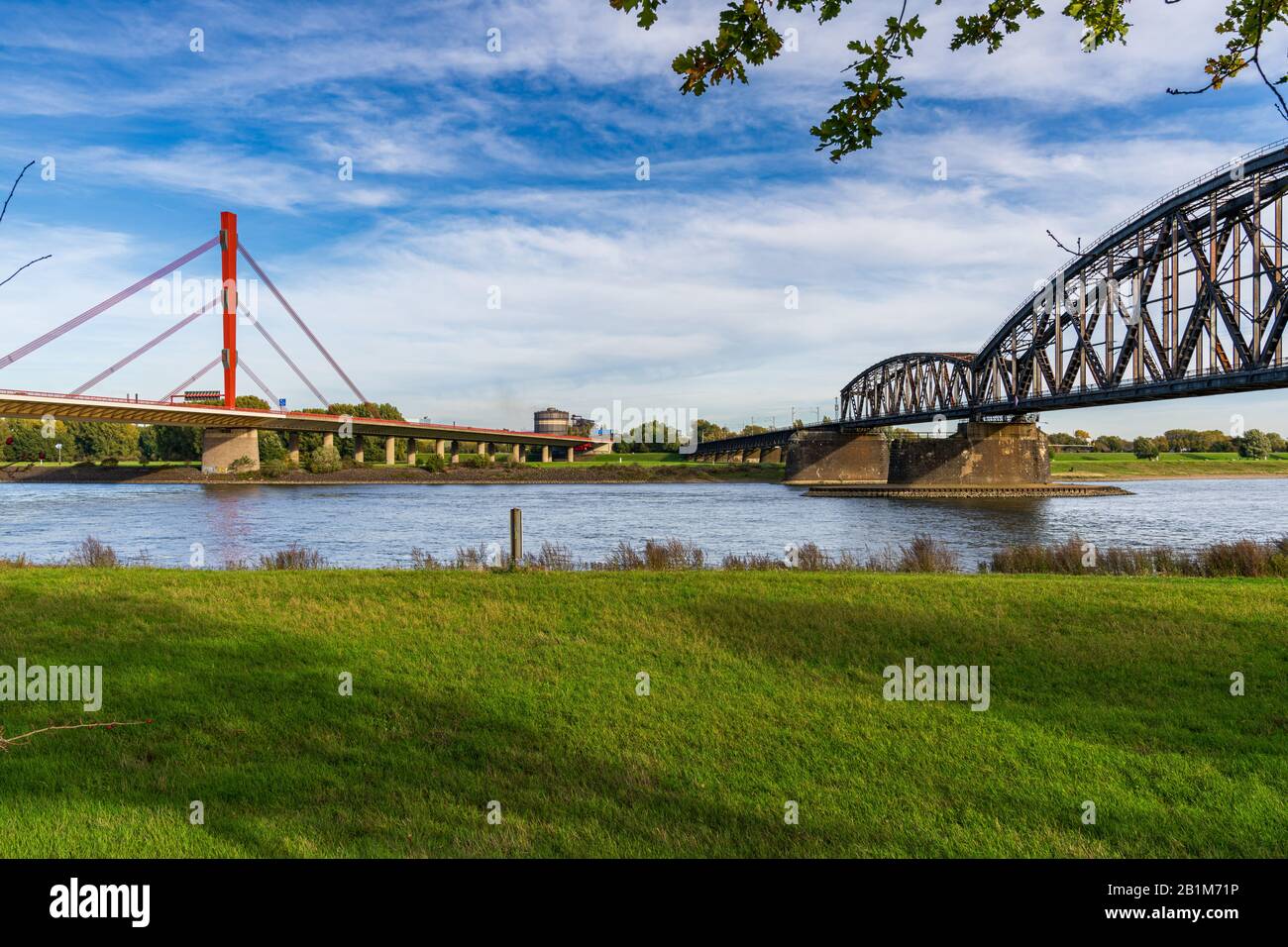 Duisburg, North Rhine-Westfalia, Germany - October 26, 2019: View at the River Rhine in Duisburg-Baerl with the Beeckerwerther Bridge on the left and Stock Photo
