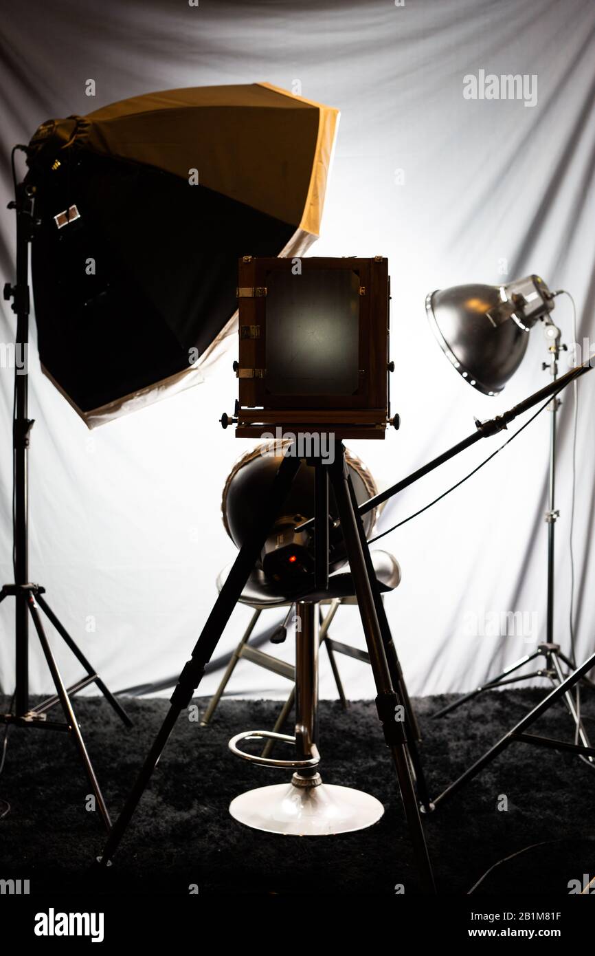 Lighting set in a studio with a large old wooden camera Stock Photo