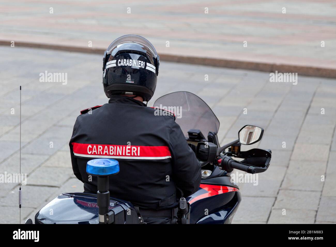 Bologna, Italy - April 02 2019: Carabinieri on his motorcycle waiting on Piazza Maggiore in old town. Stock Photo