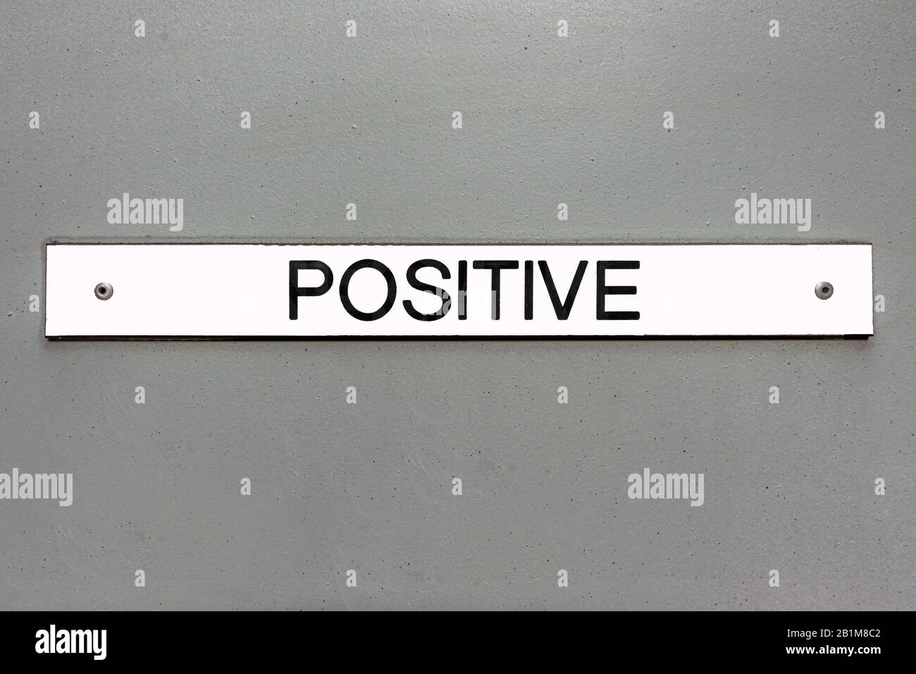 Positive sign on a grey panel background Stock Photo