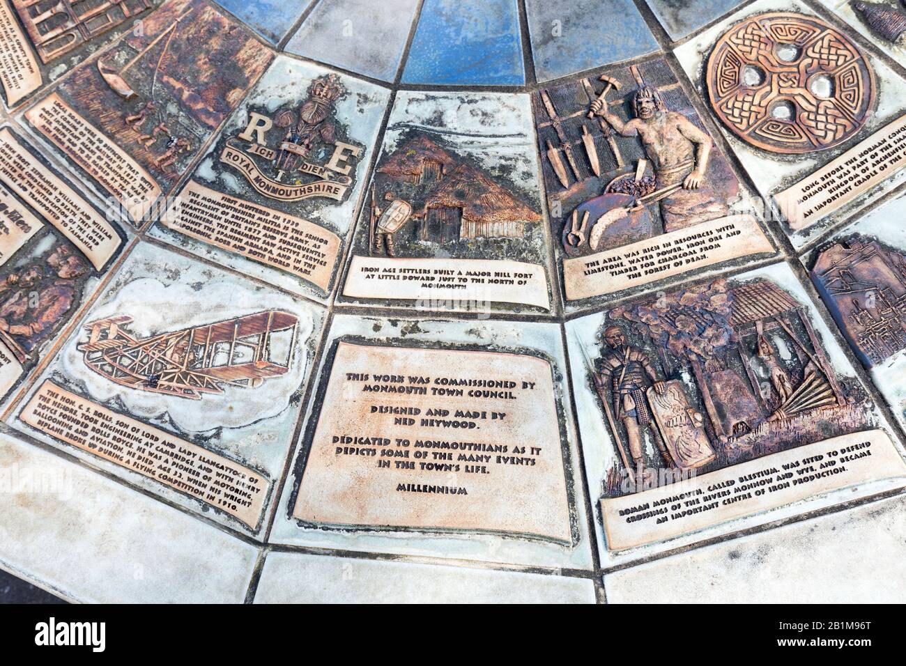 Part of Millennium ceramic mosaic wheel by Ned Heywood at the Monnow Bridge commemorating Monmouth's history, Wales, UK Stock Photo