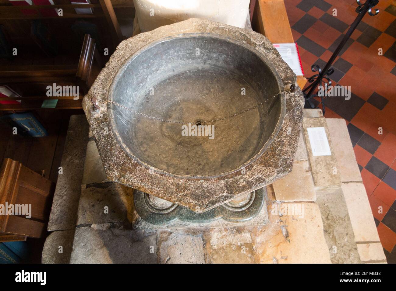 Late Norman 12th century stone octagonal Baptismal font carved from Purbeck marble inside Bosham