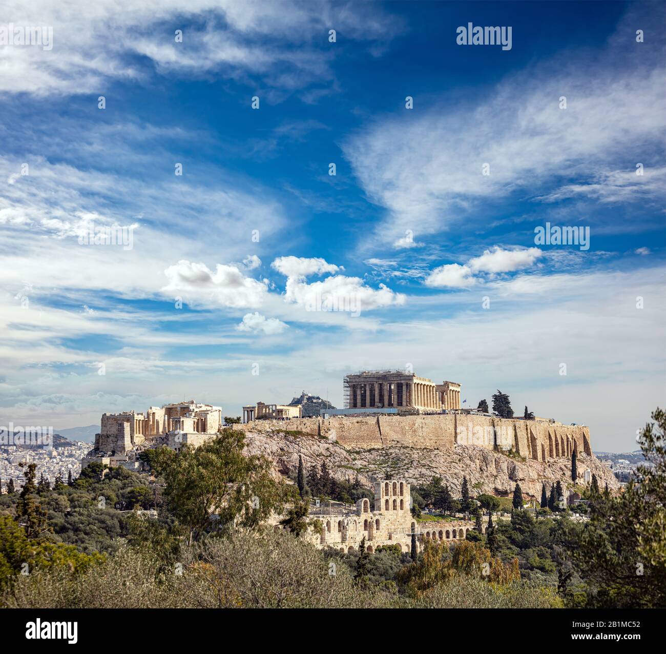 Athens, Greece. Acropolis and Parthenon temple, top landmark. Scenic view of ancient Greece remains from Philopappos or Filopappos Hill cloudy blue sk Stock Photo